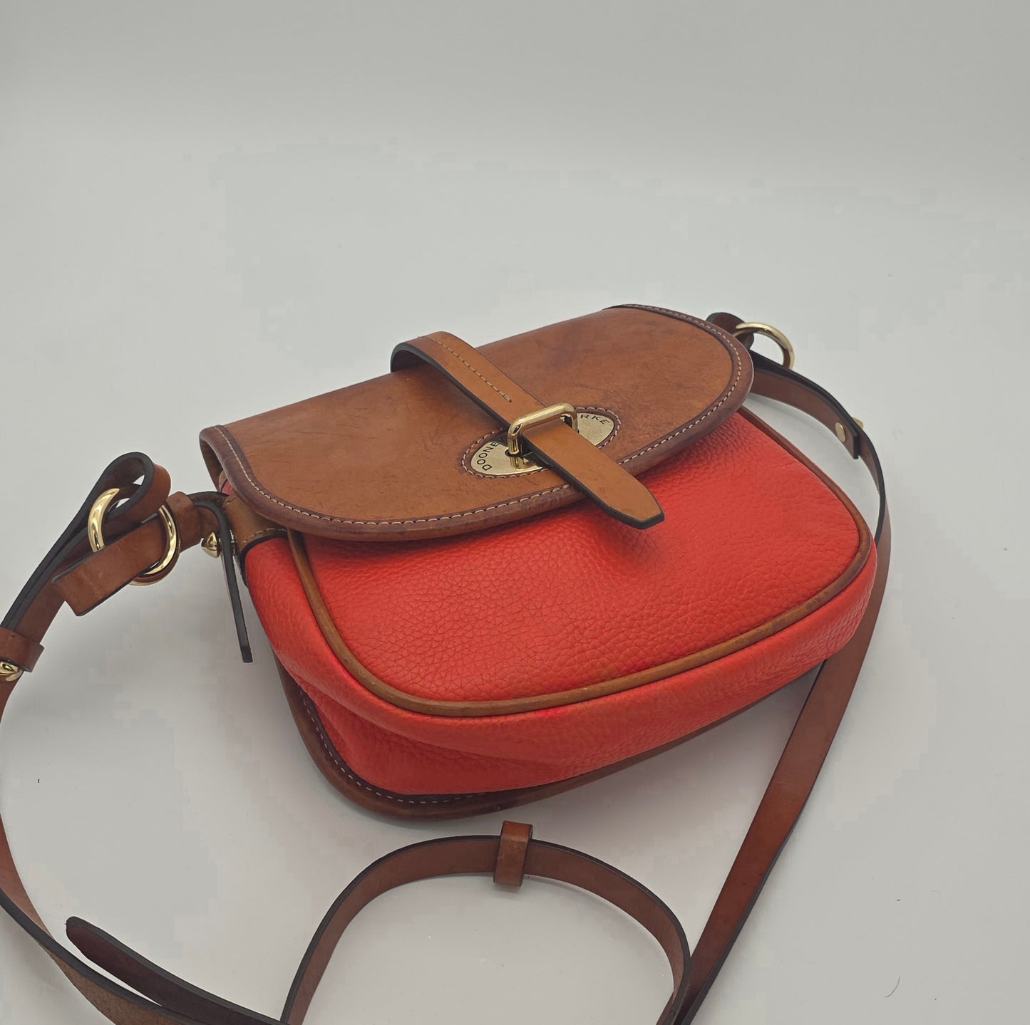 Dooney & Bourke Two-Tone Saddle Crossbody – Coral & Tan, Gold Hardware